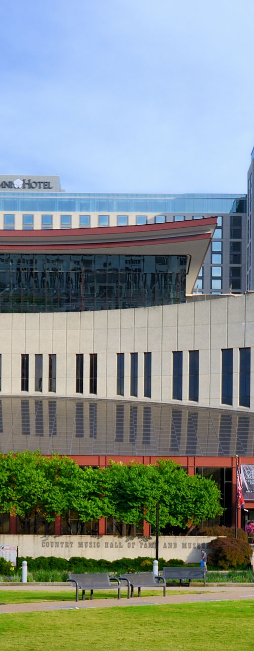 Modern museum building with urban backdrop