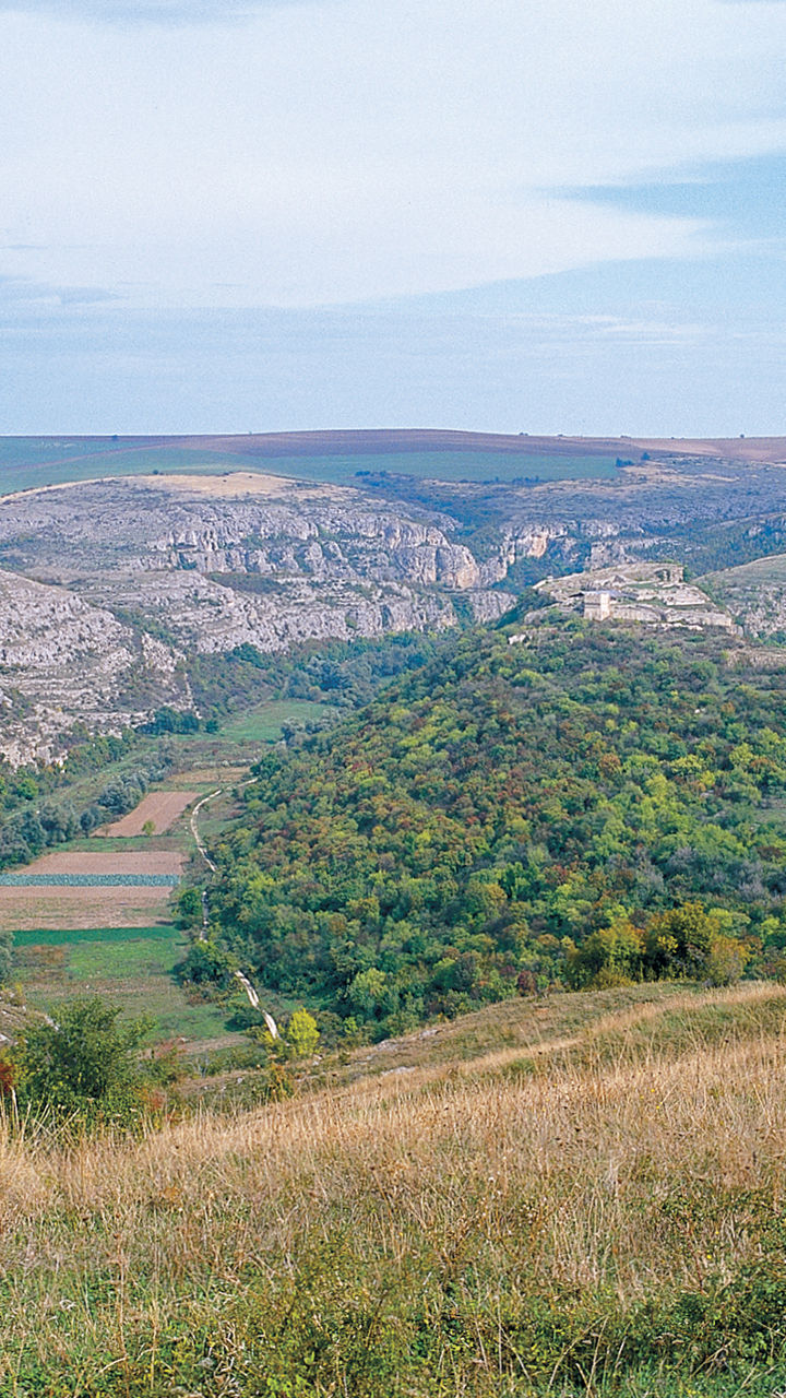 Scenic valley with rolling hills and cliffs