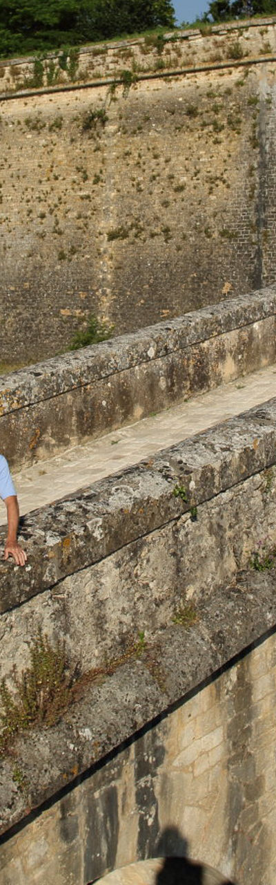 Couple exploring historic stone fortress