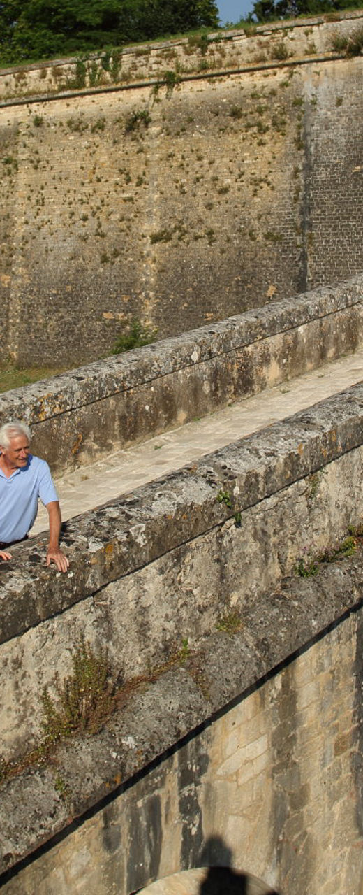 Couple exploring historic stone fortress