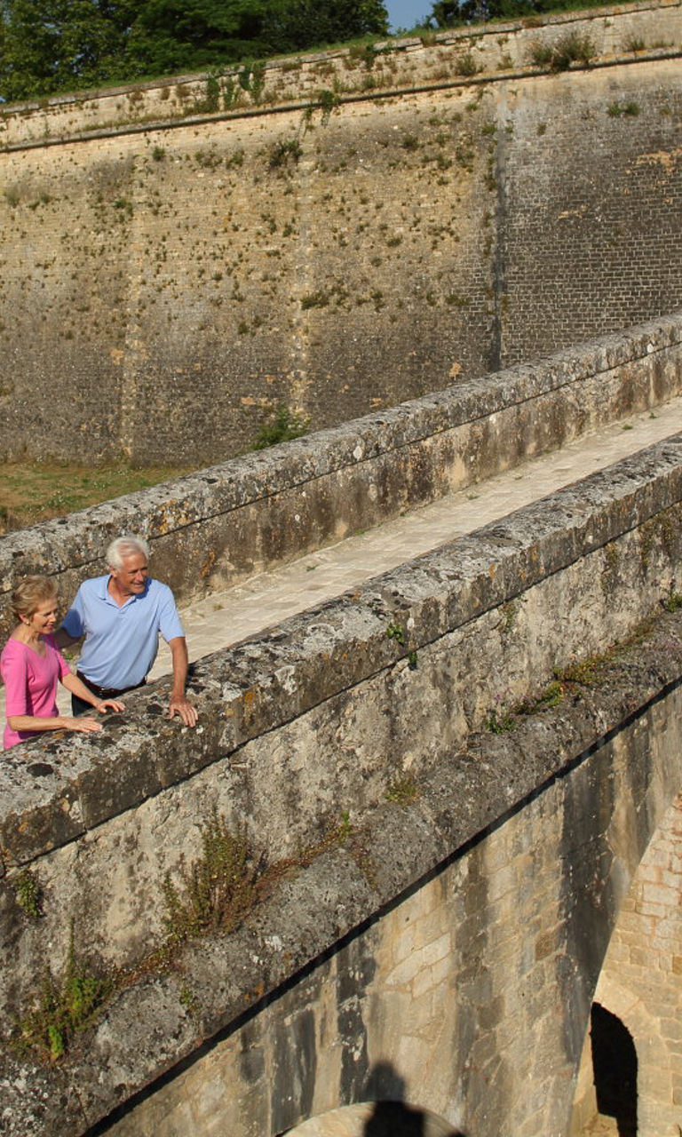 Couple exploring historic stone fortress
