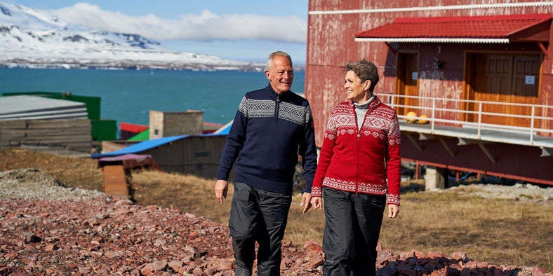 Couple walking near Arctic building