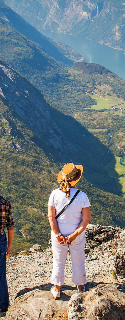 Two hikers overlooking scenic mountain valley