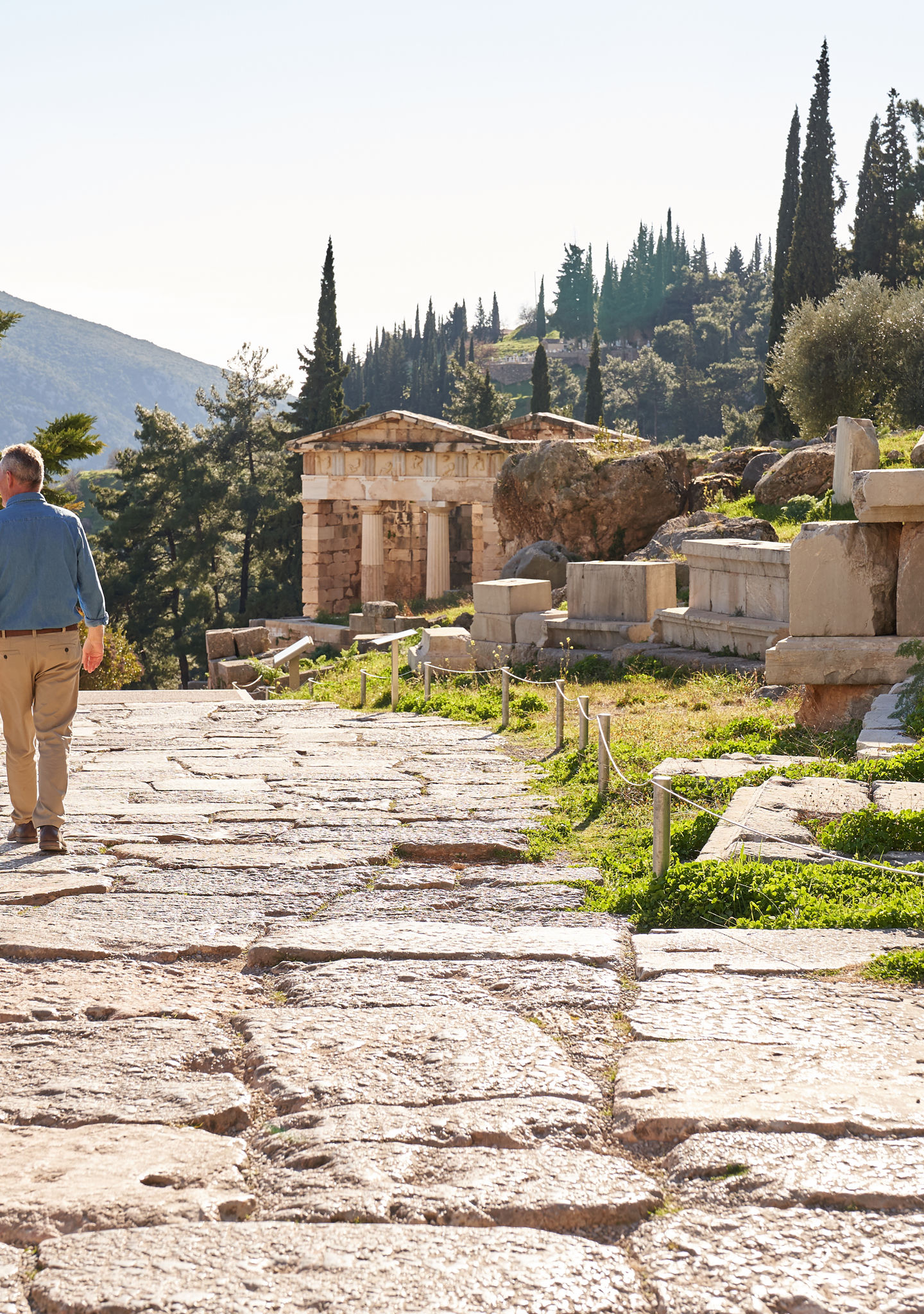 Couple exploring ancient ruins in sunlight