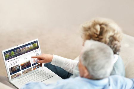 Older couple browsing travel options online