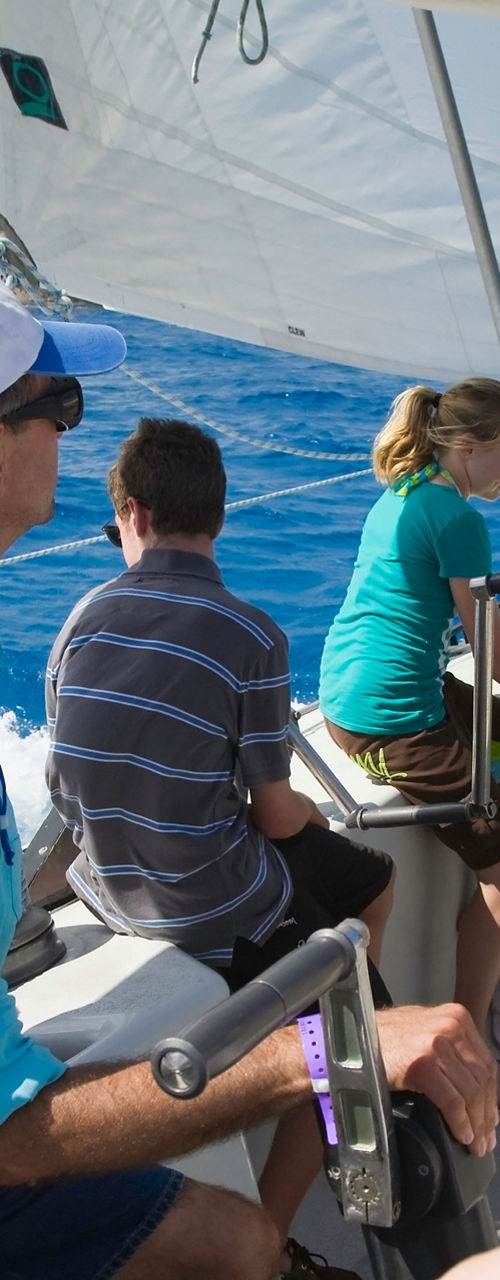 Group sailing on open blue waters