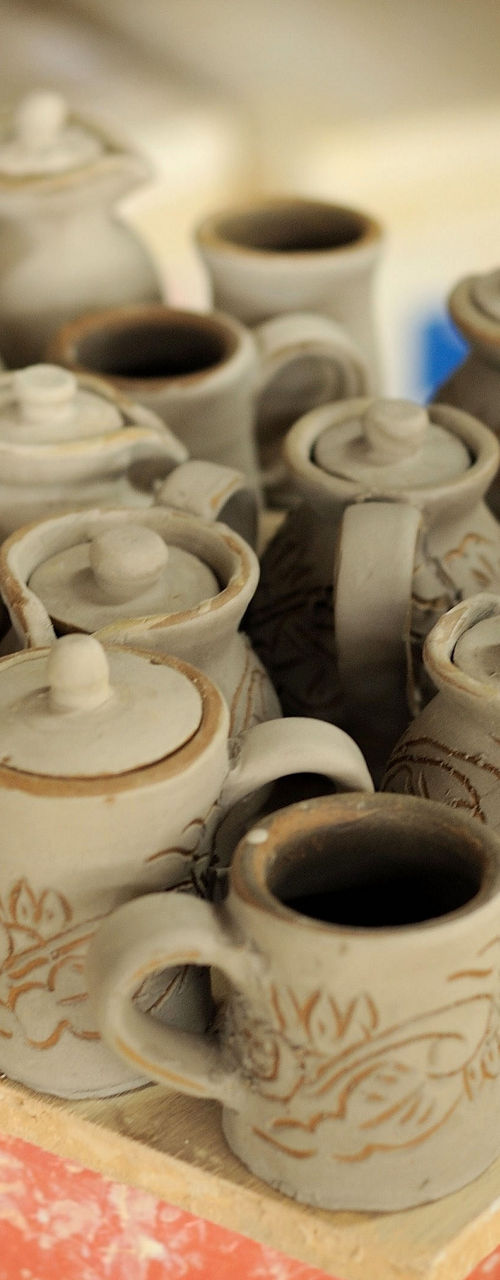 Handcrafted clay pottery in workshop setting
