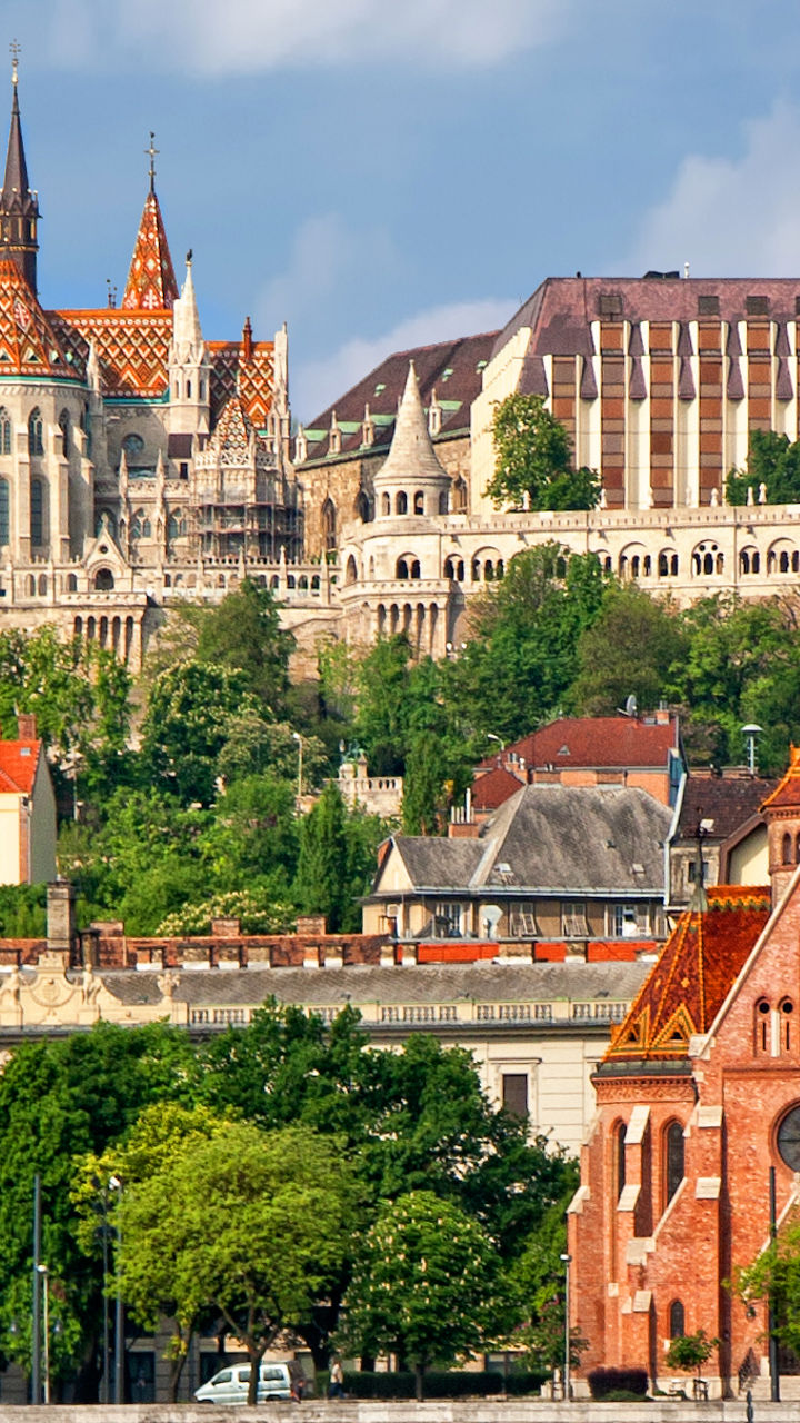 Historic Budapest skyline with river reflections