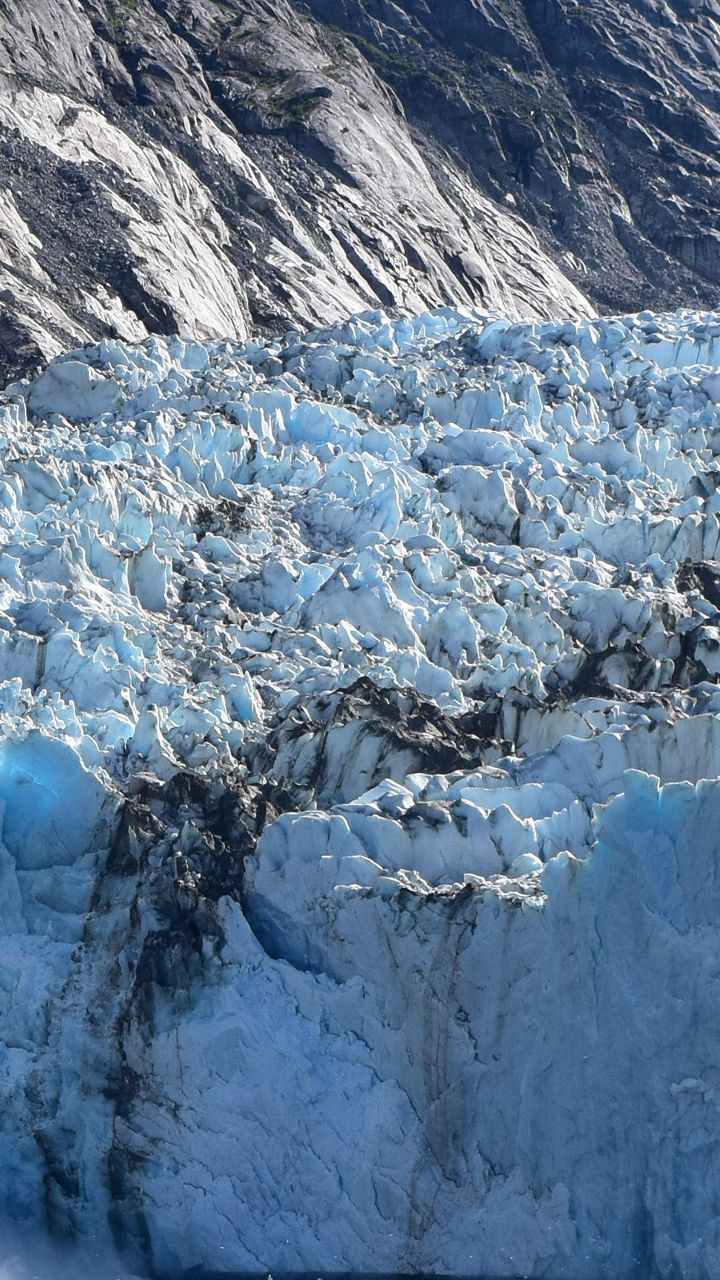 Majestic glacier calving into icy waters