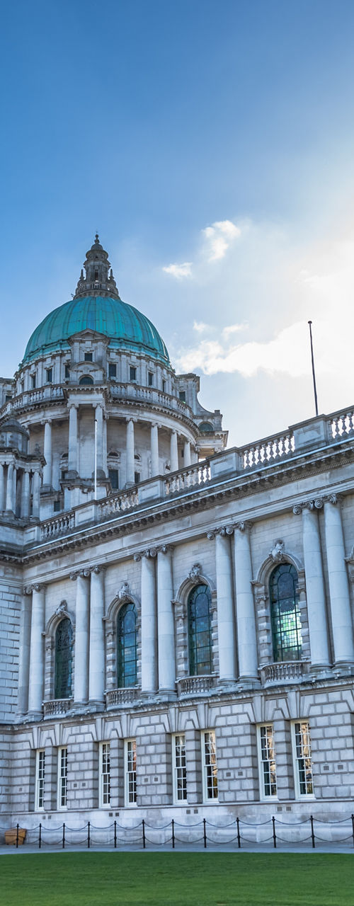 Historic Belfast City Hall under blue sky
