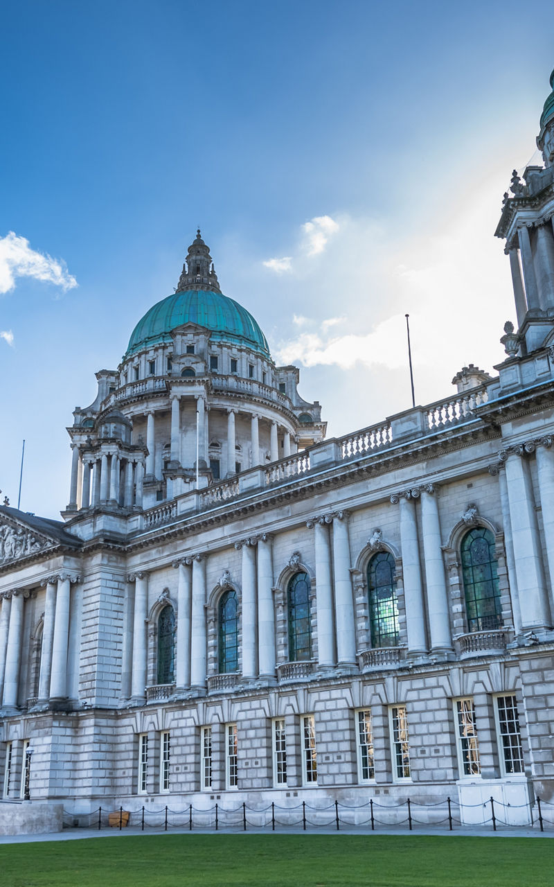 Historic Belfast City Hall under blue sky