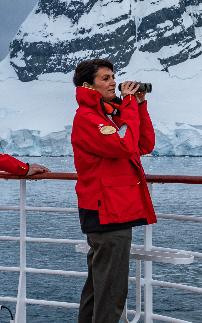 Tourists observing icy landscape on cruise