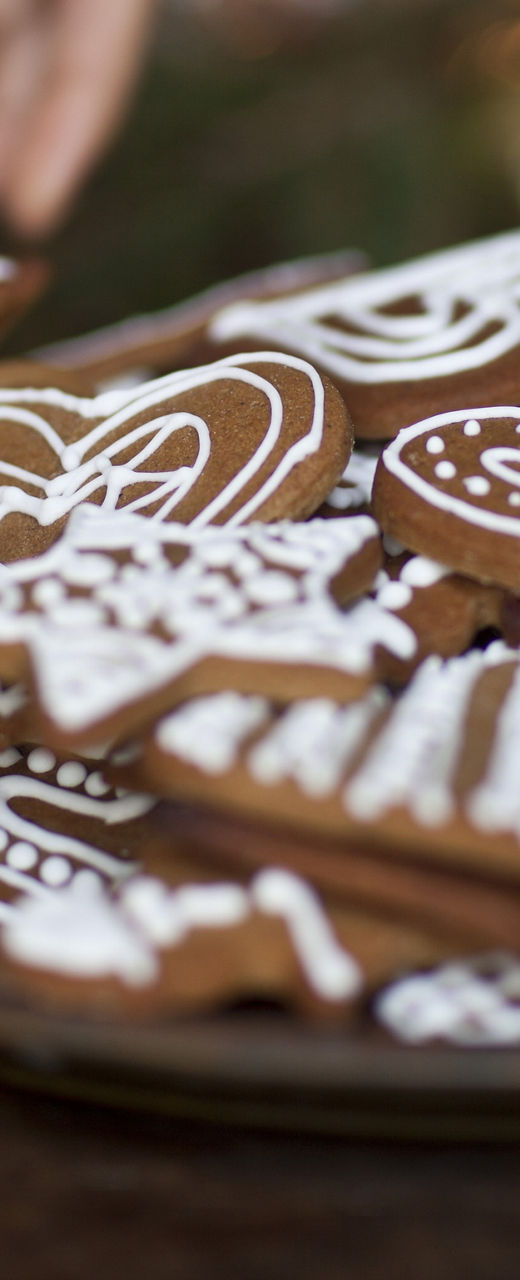 Decorating festive gingerbread cookies on a plate