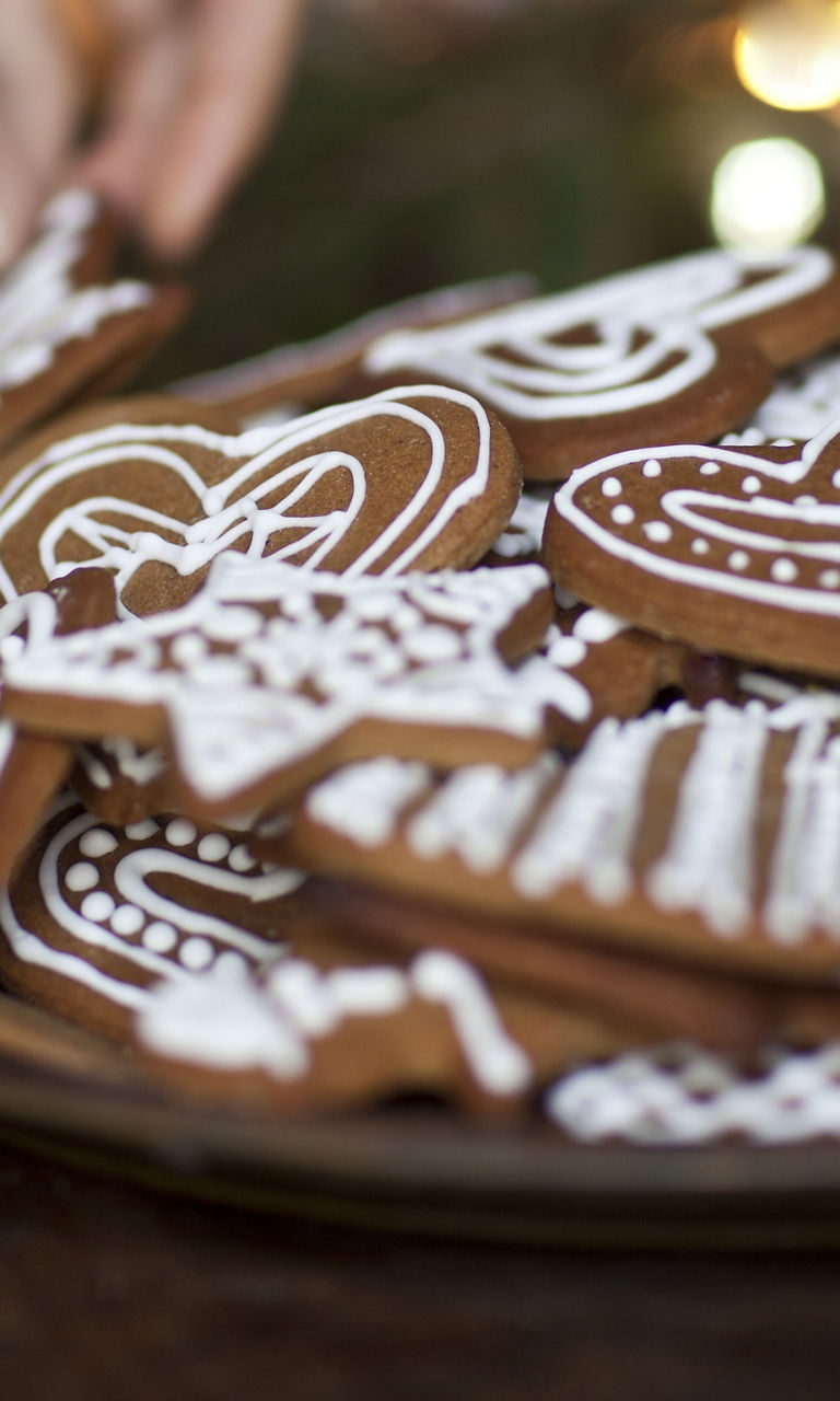 Decorating festive gingerbread cookies on a plate