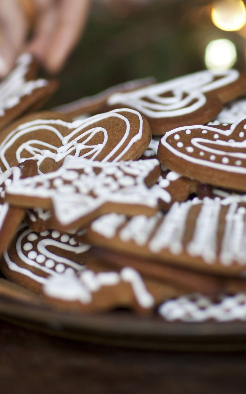 Decorating festive gingerbread cookies on a plate