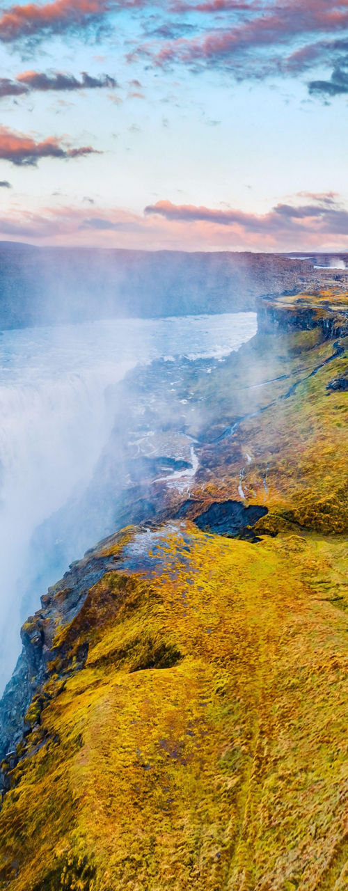 Majestic Waterfall in Rugged Landscape