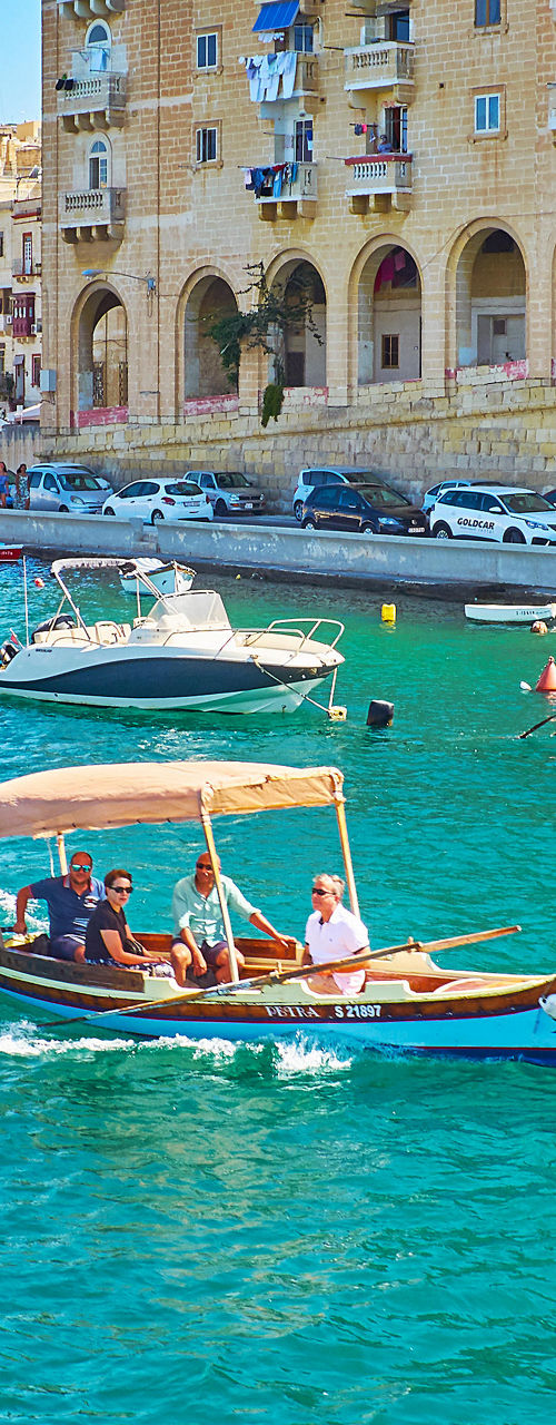 Traditional boat in vibrant harbor setting