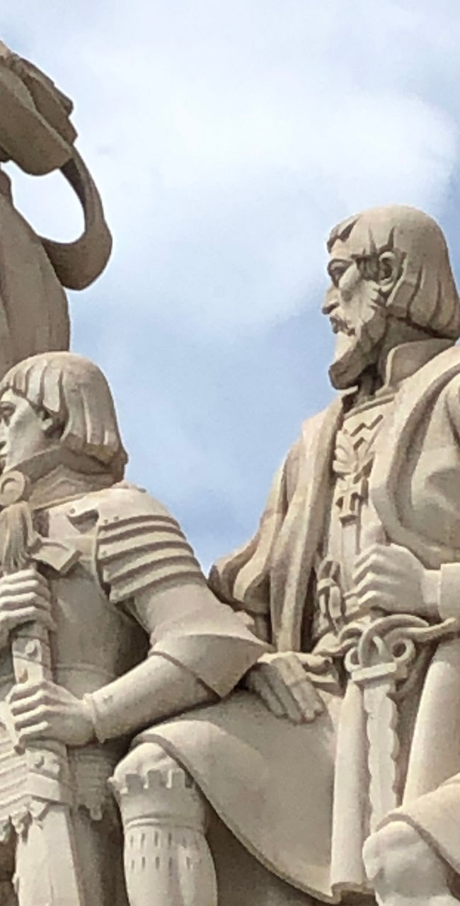 Monument of explorers under blue sky