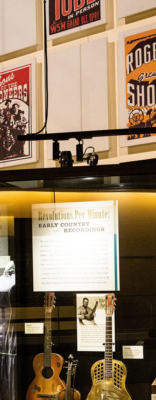 Museum exhibit showcasing vintage guitars