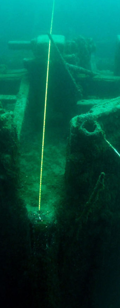 Underwater diver exploring shipwreck remains
