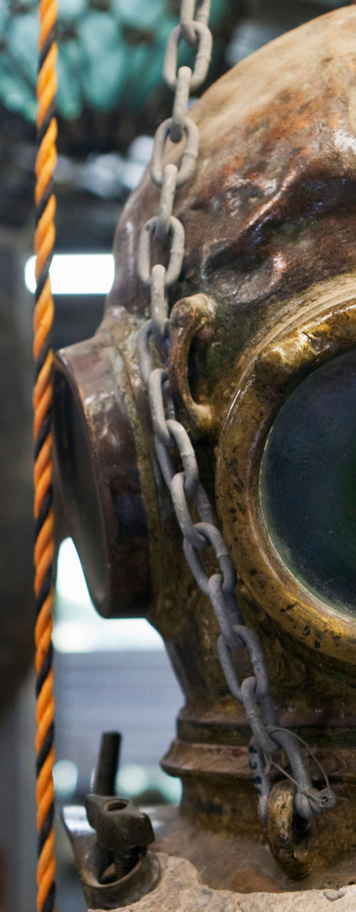 Vintage diving helmet in museum exhibit