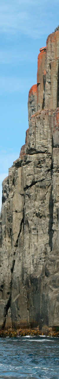 Majestic coastal cliffs under blue sky