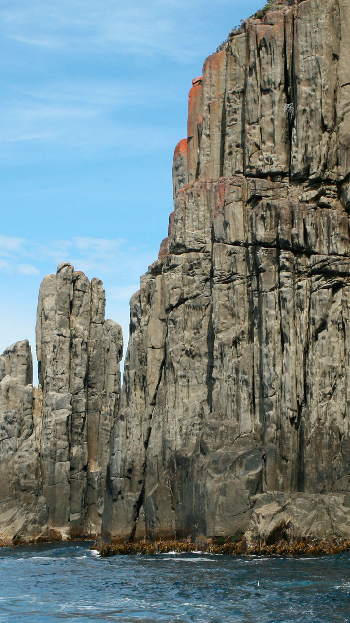 Majestic coastal cliffs under blue sky