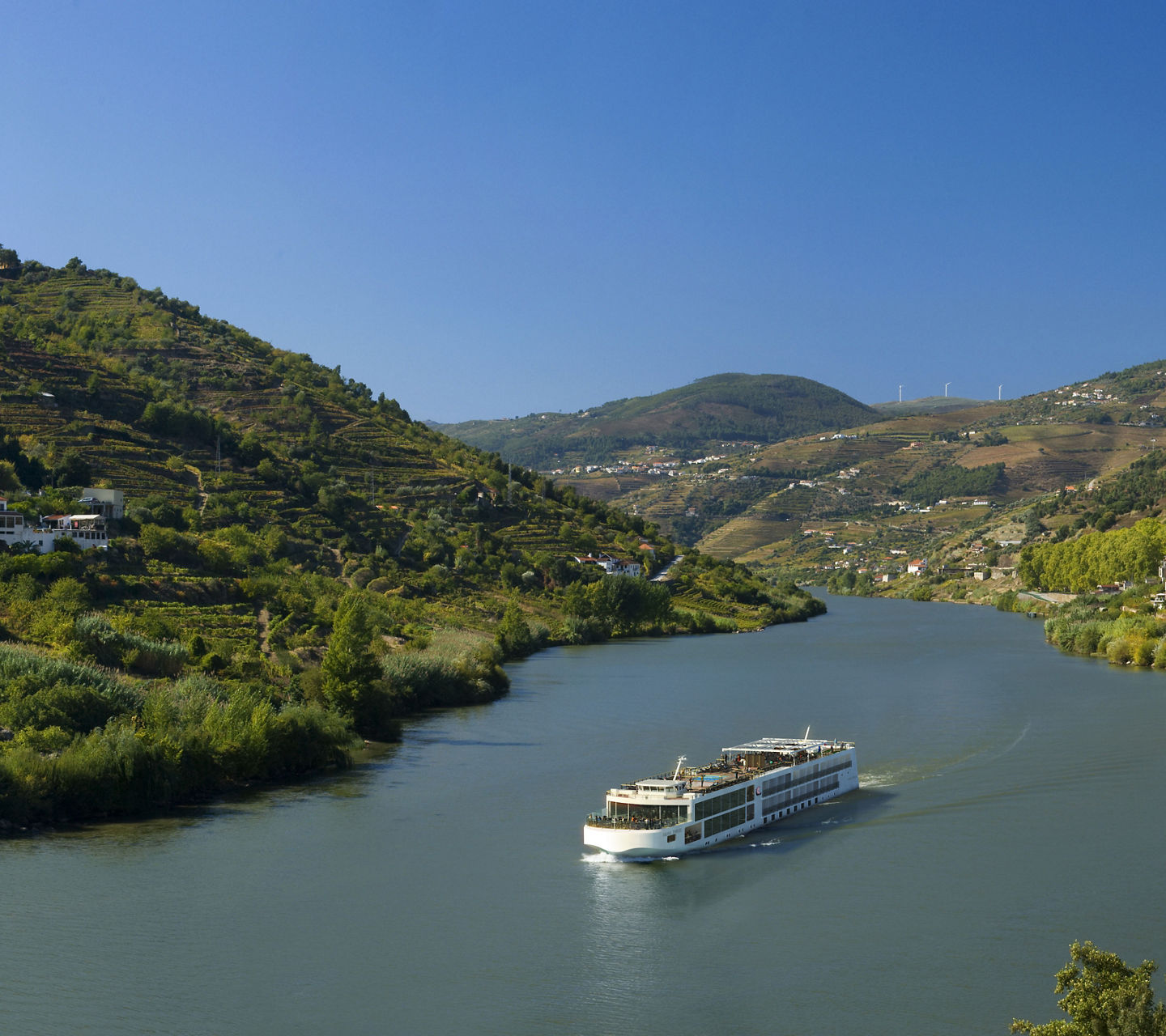Scenic river cruise through lush valley