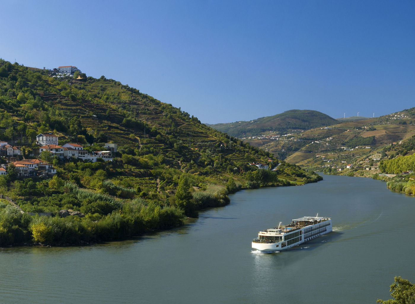 Scenic river cruise through lush valley