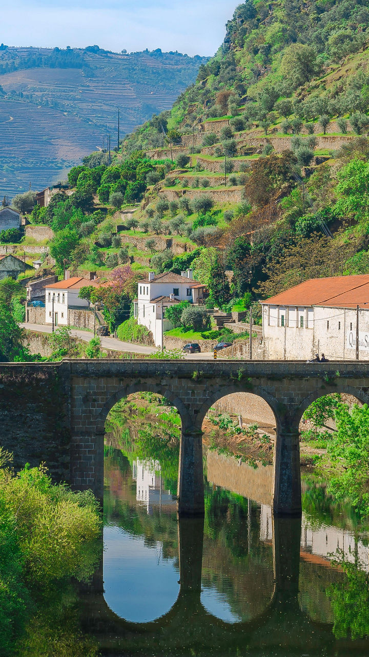 Scenic bridge over river in rural village