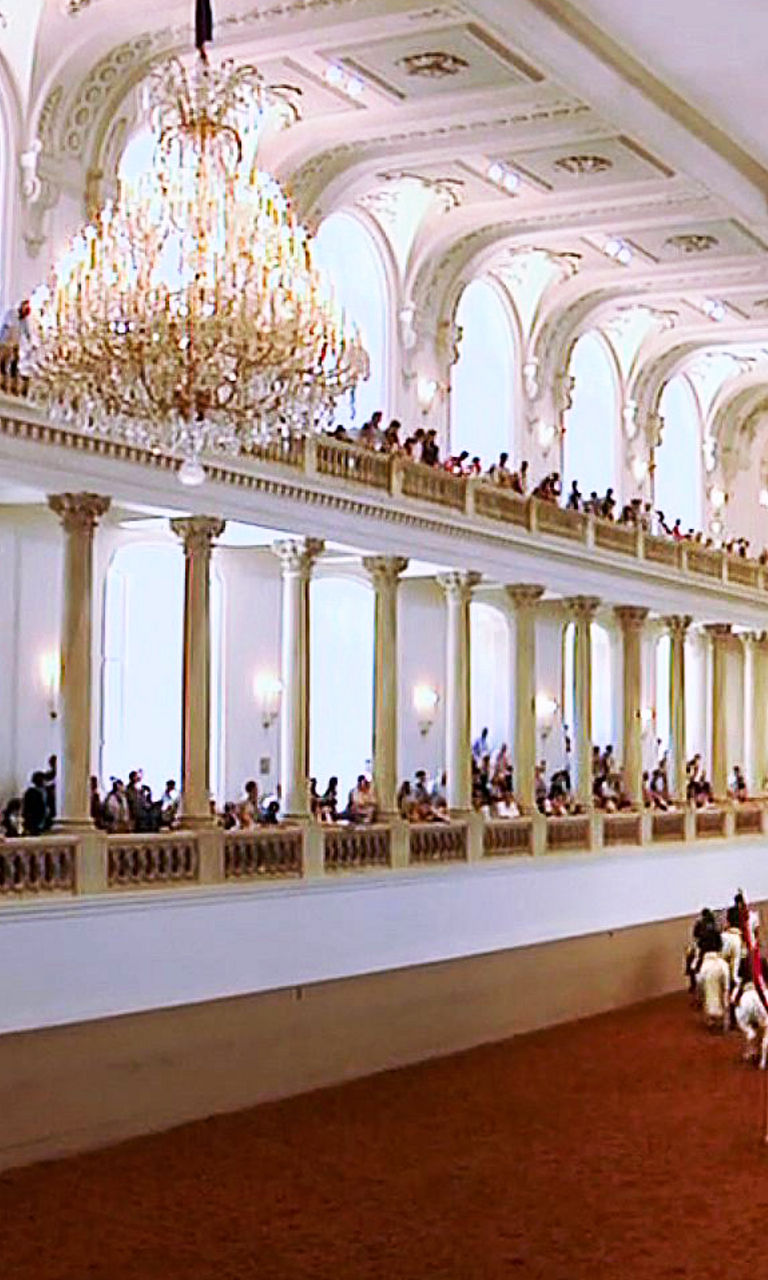 Equestrian performance in grand indoor arena