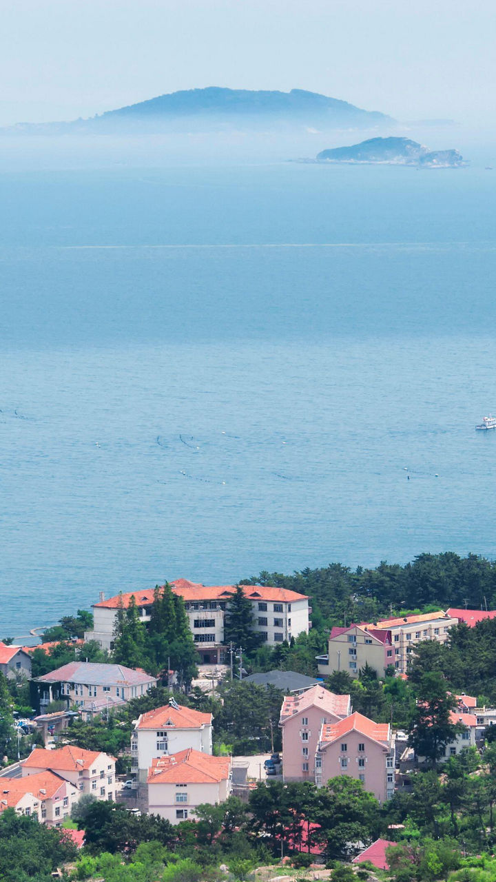 Coastal town with ocean and distant island