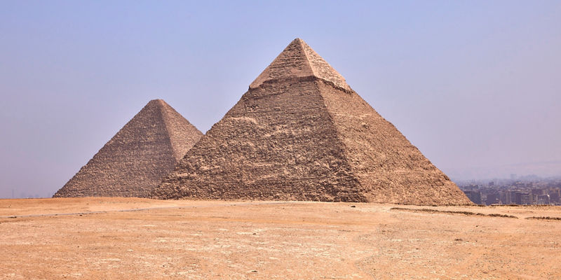 Ancient pyramids in desert landscape
