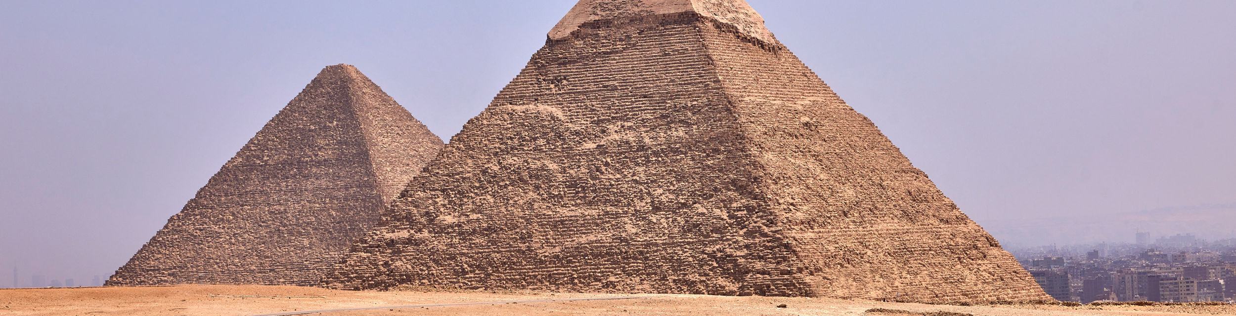 Ancient pyramids in desert landscape