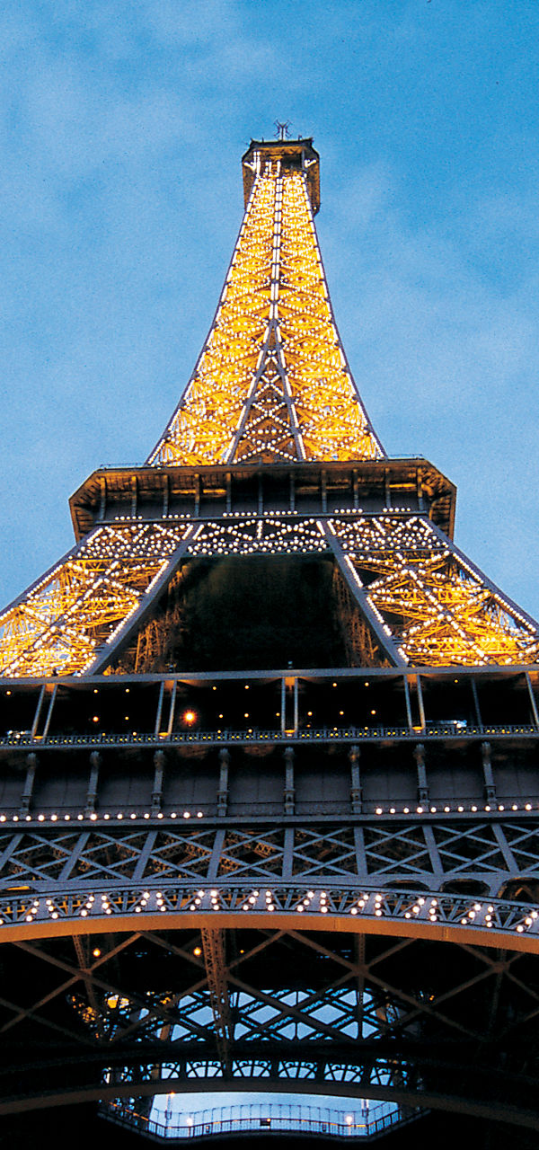 Illuminated Eiffel Tower at dusk