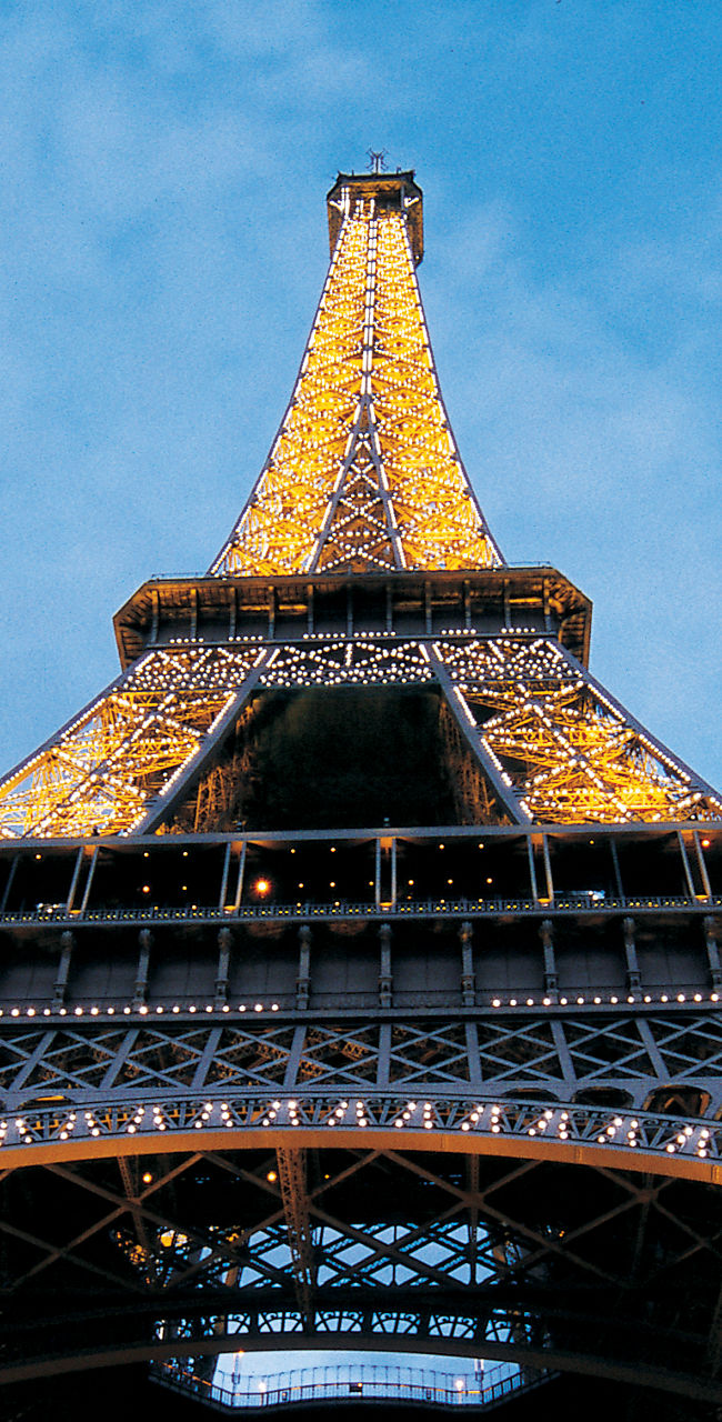 Illuminated Eiffel Tower at dusk