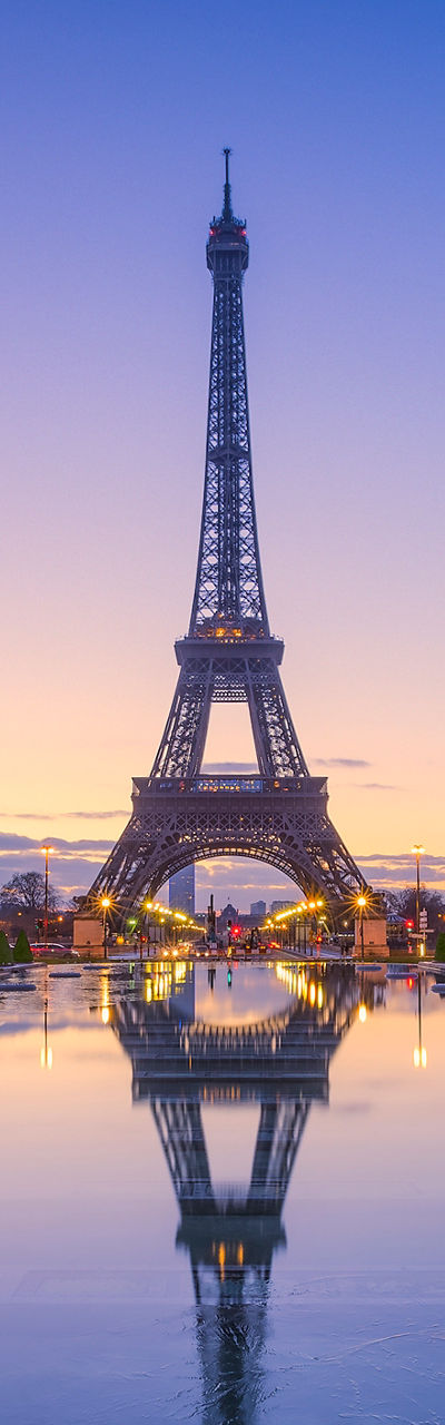 Eiffel Tower at sunrise with reflection