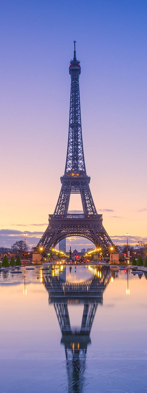 Eiffel Tower at sunrise with reflection