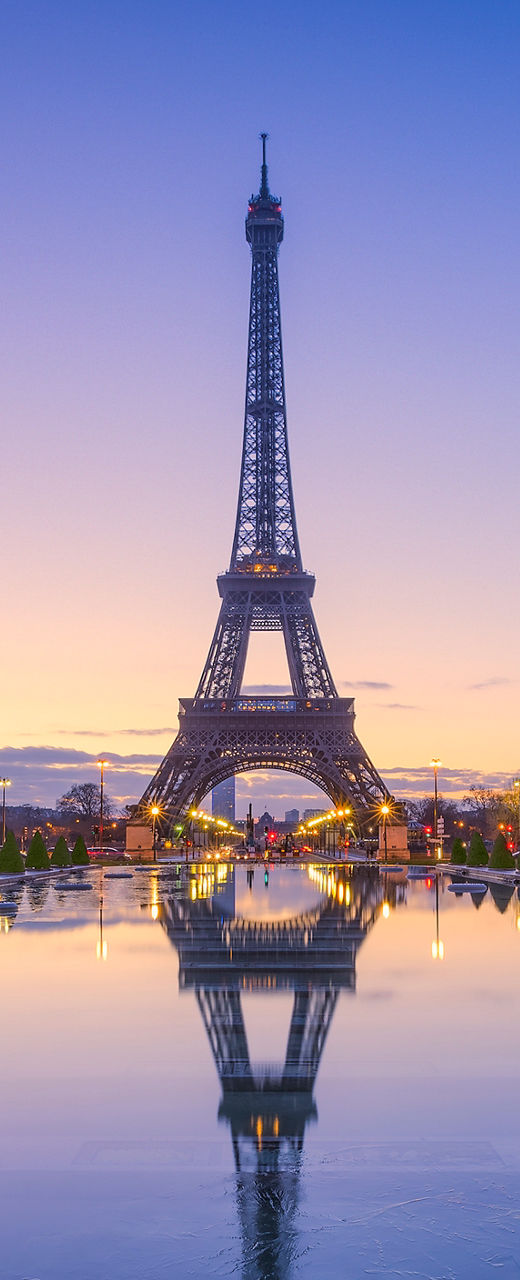 Eiffel Tower at sunrise with reflection