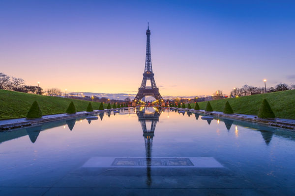 Eiffel Tower at sunrise with reflection