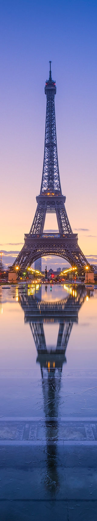 Eiffel Tower at sunrise with reflection
