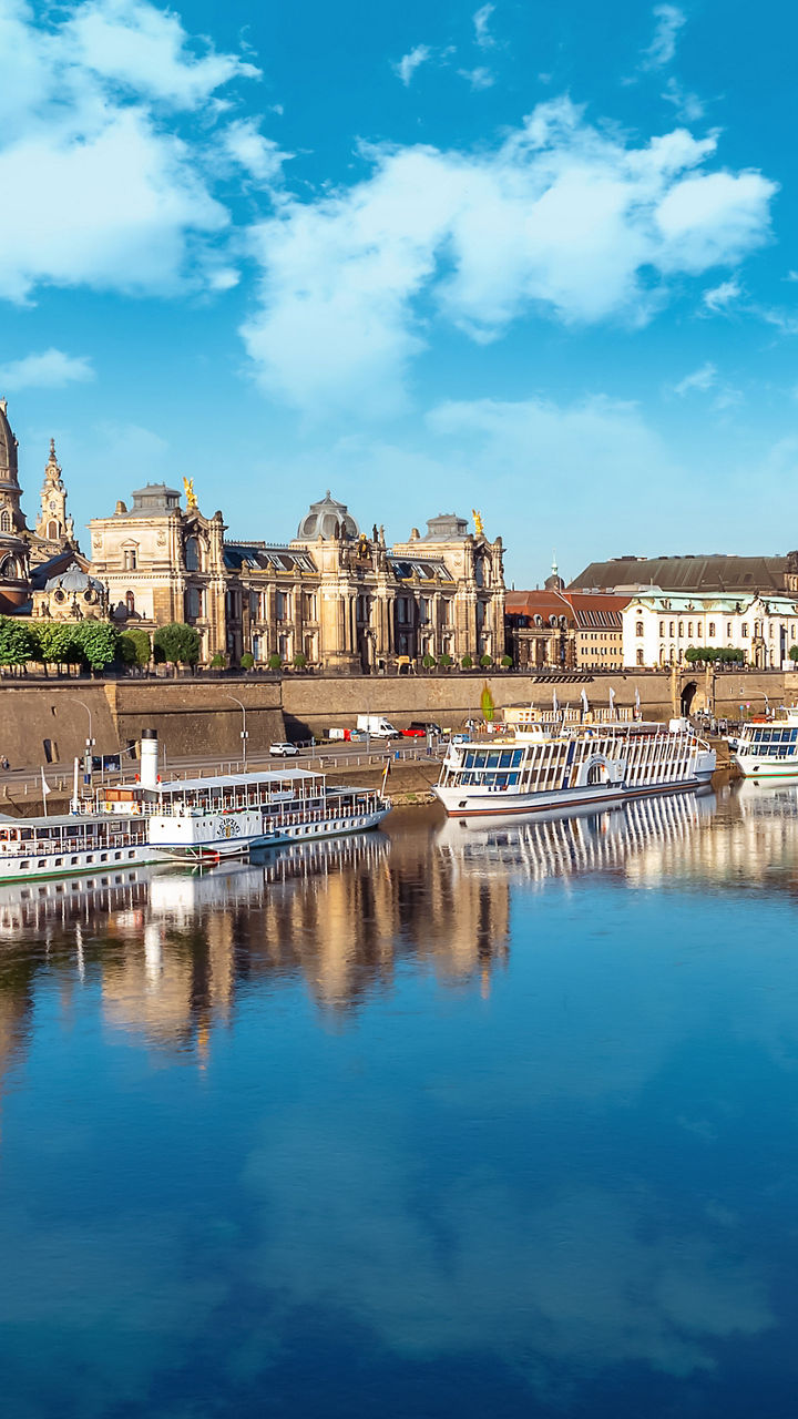 Historic European cityscape reflected in river