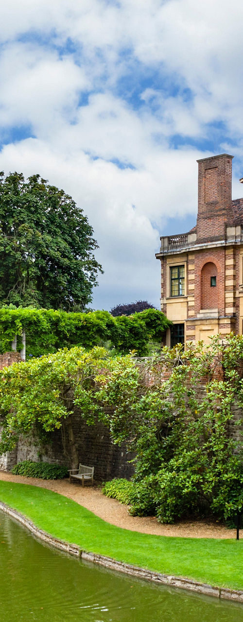 Historic estate with lush gardens and pond
