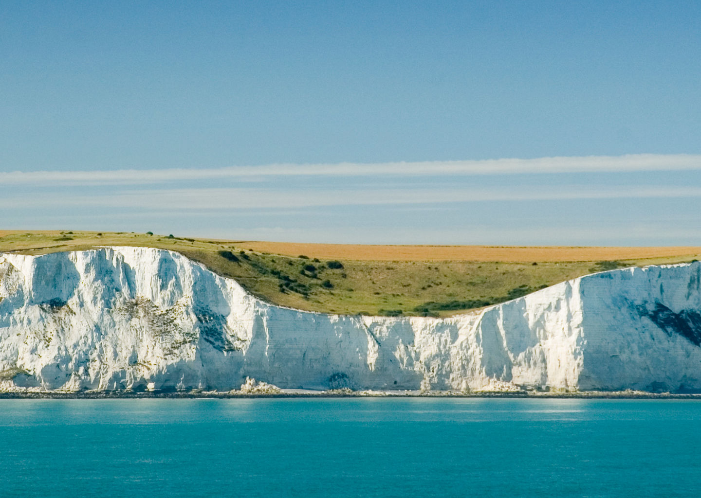 White cliffs overlooking calm blue sea