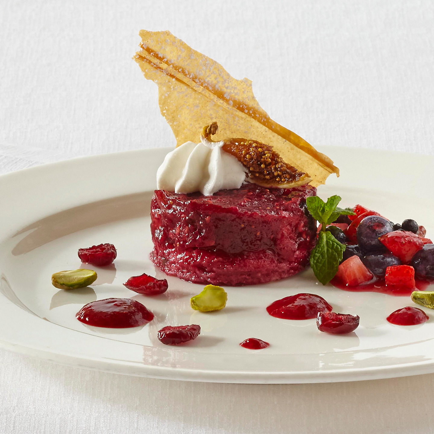 Elegant dessert with berries and cream