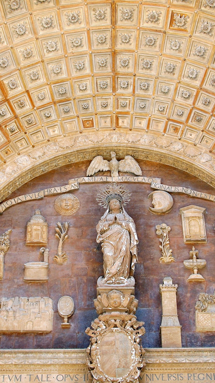 Ornate stone archway with statues and carvings