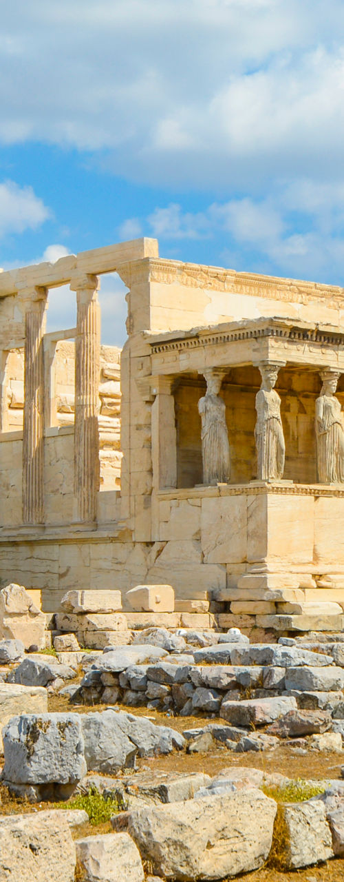Ancient Greek temple under blue sky