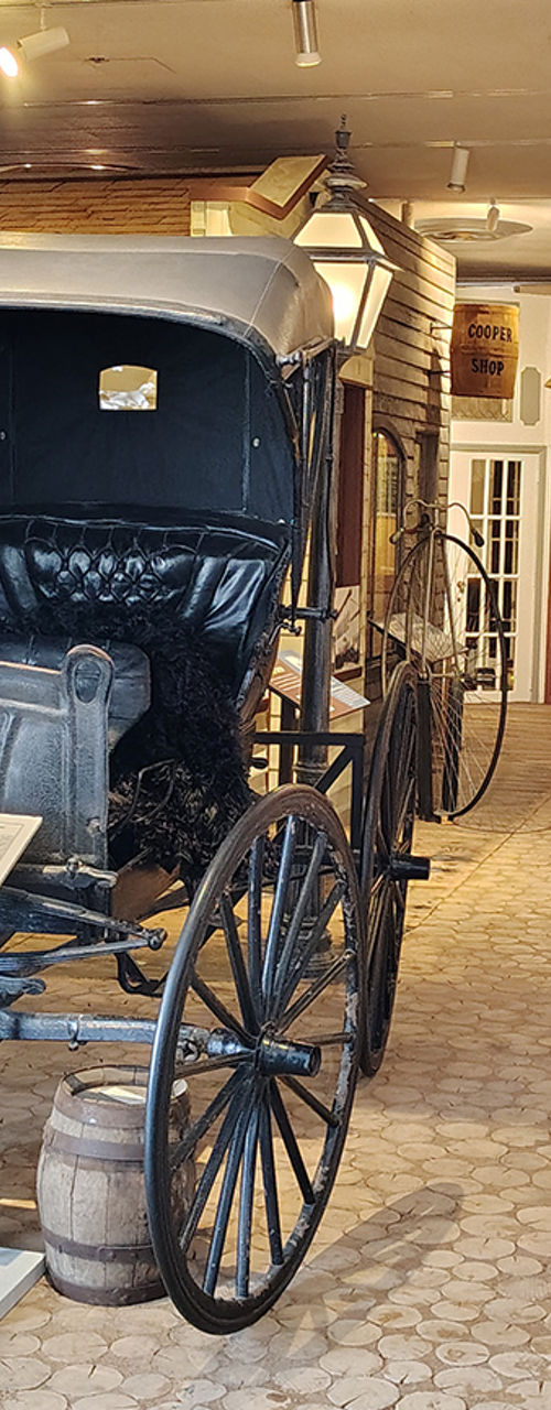 Historic Avenue of Shops with Vintage Carriage Display