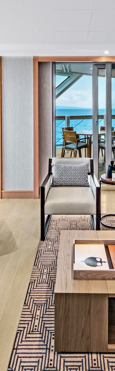 Modern oceanfront living room with dining area