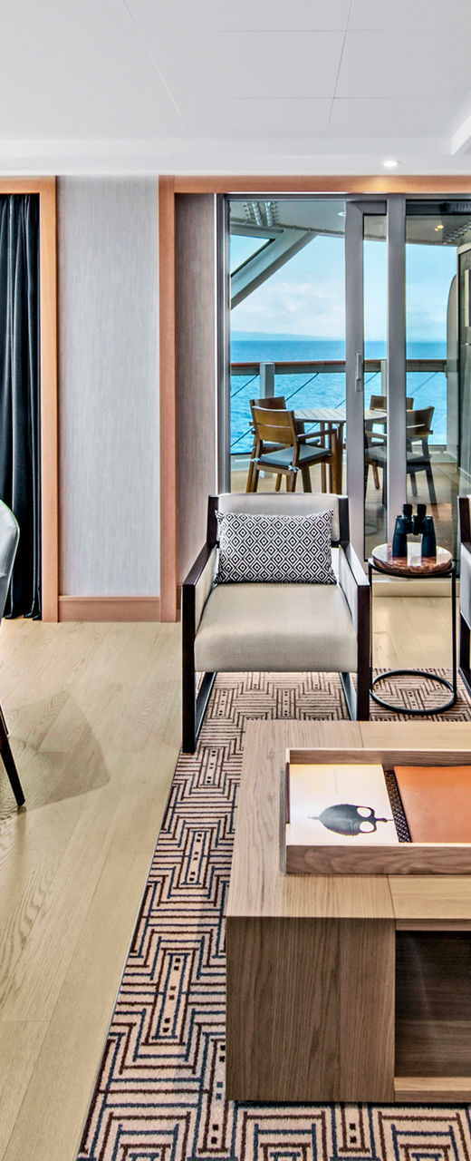 Modern oceanfront living room with dining area